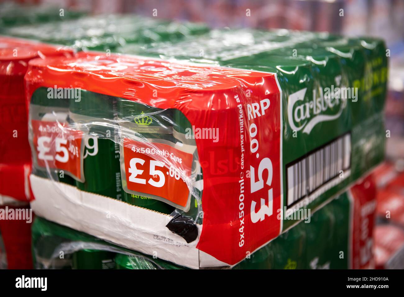 Packs of Carlsberg cans of sale at First and Last off-licence in Jonesborough, just south of Newry in Northern Ireland. Minimum unit alcohol pricing comes into effect in Ireland from Tuesday which could drive customers to travel from Ireland crossing the border to purchase lower priced alcohol. Picture date: Tuesday January 4 2021. Stock Photo
