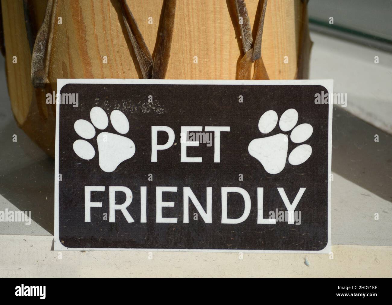 A sign in a Santa Fe, New Mexico, store window advises that the shop is pet friendly and welcomes customers with dogs. Stock Photo