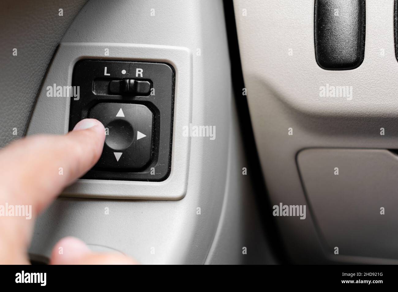 Adjusting side mirrors button (car electricity) Stock Photo