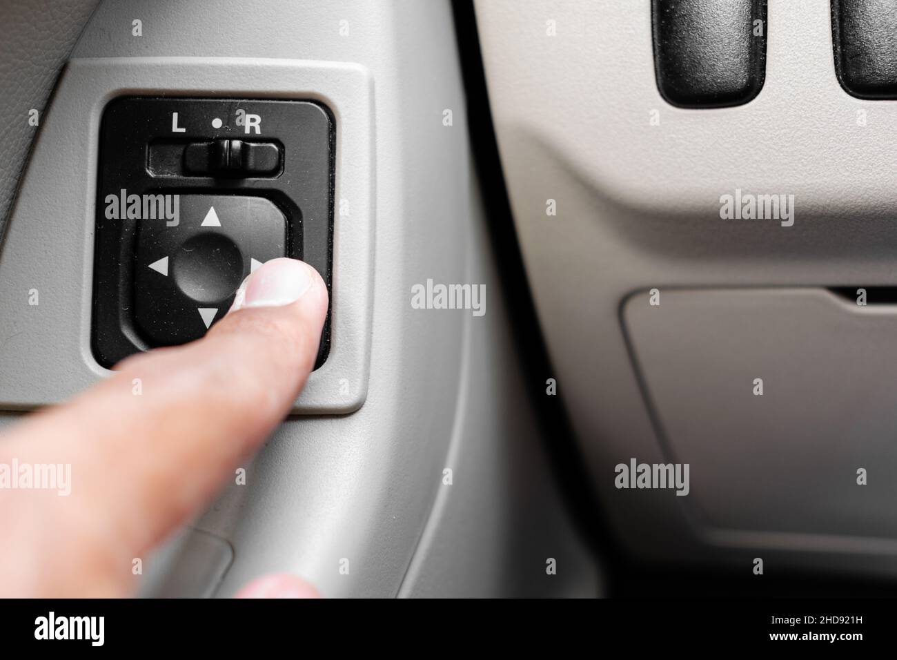 Adjusting side mirrors button (car electricity) Stock Photo