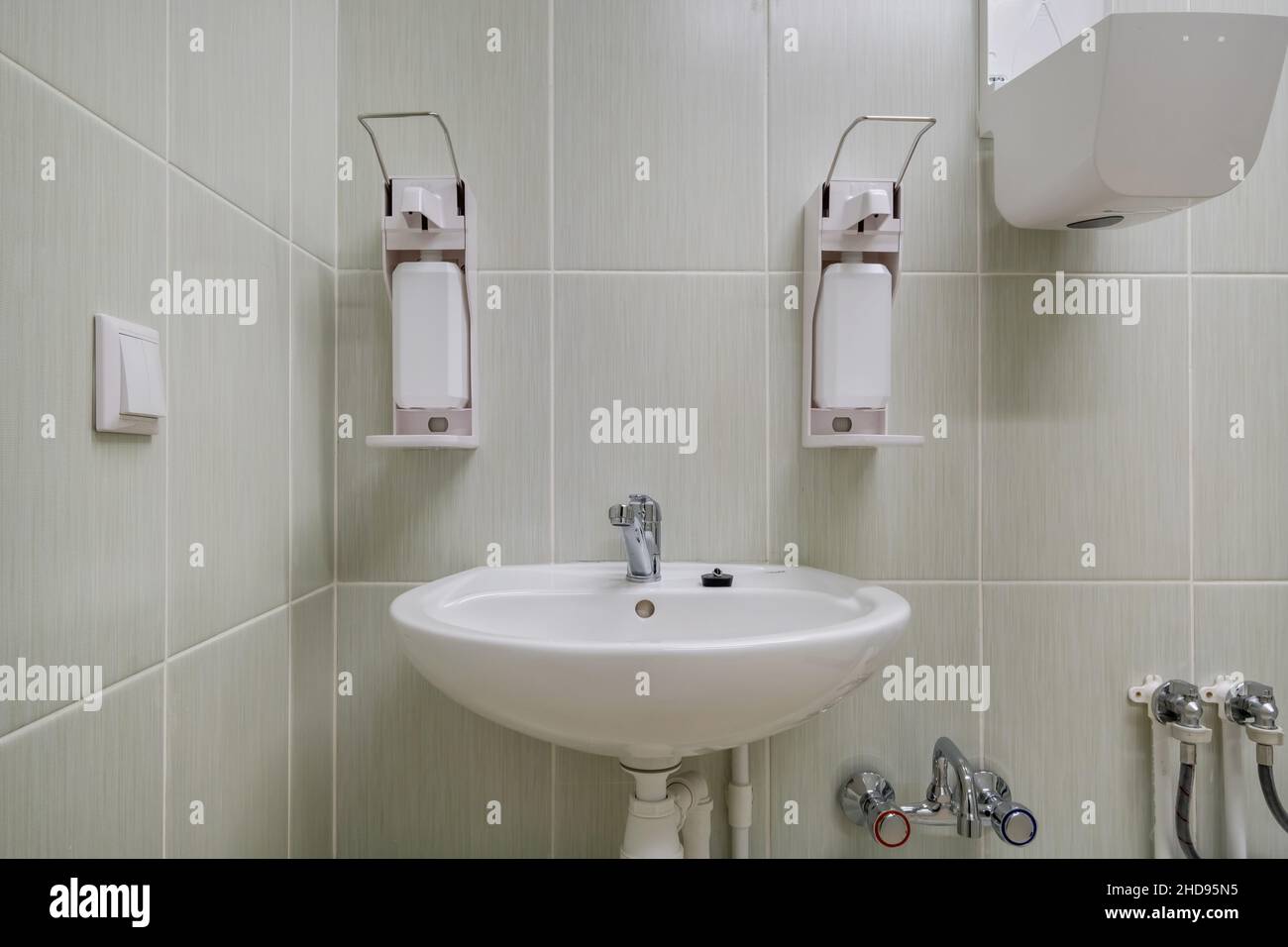 elbow soap and antiseptic dispenser or sanitizer wall mounted for hand