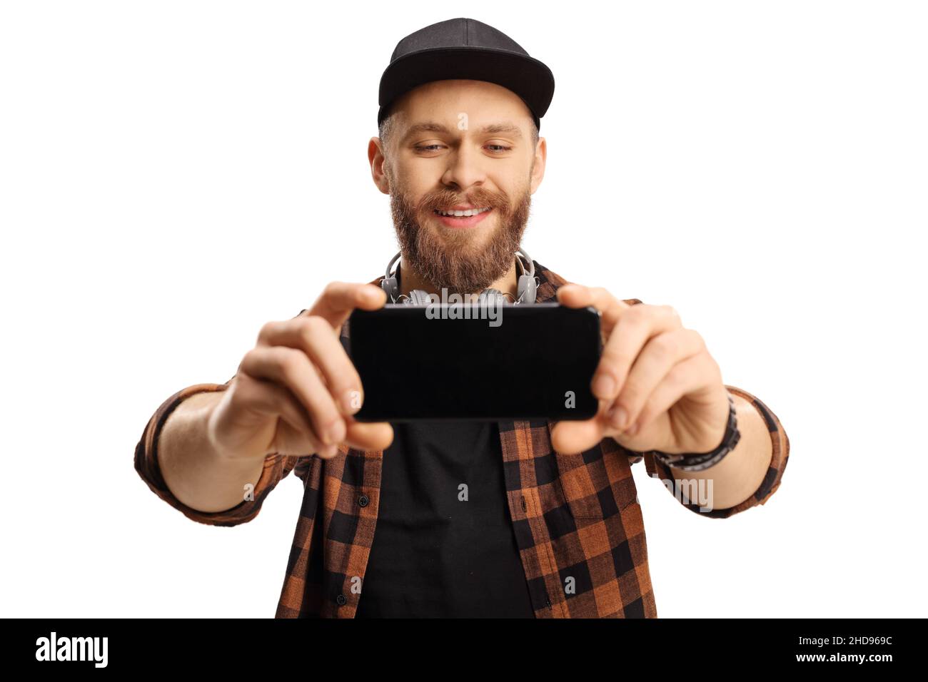 Bearded trendy guy taking a selfie photo with a smartphone isolated on ...