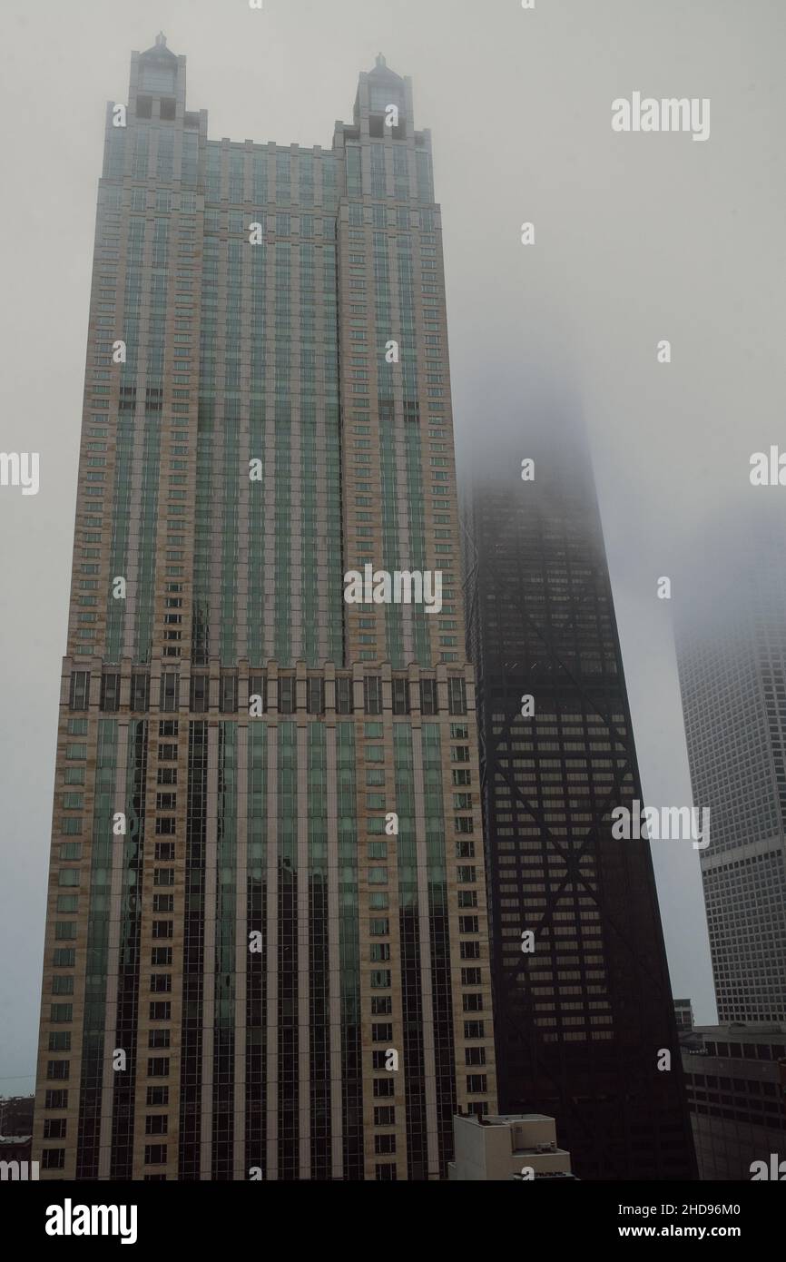 Foggy Afternoon in Downtown Chicago with Disappearing Skyscrapers into the Mist Stock Photo