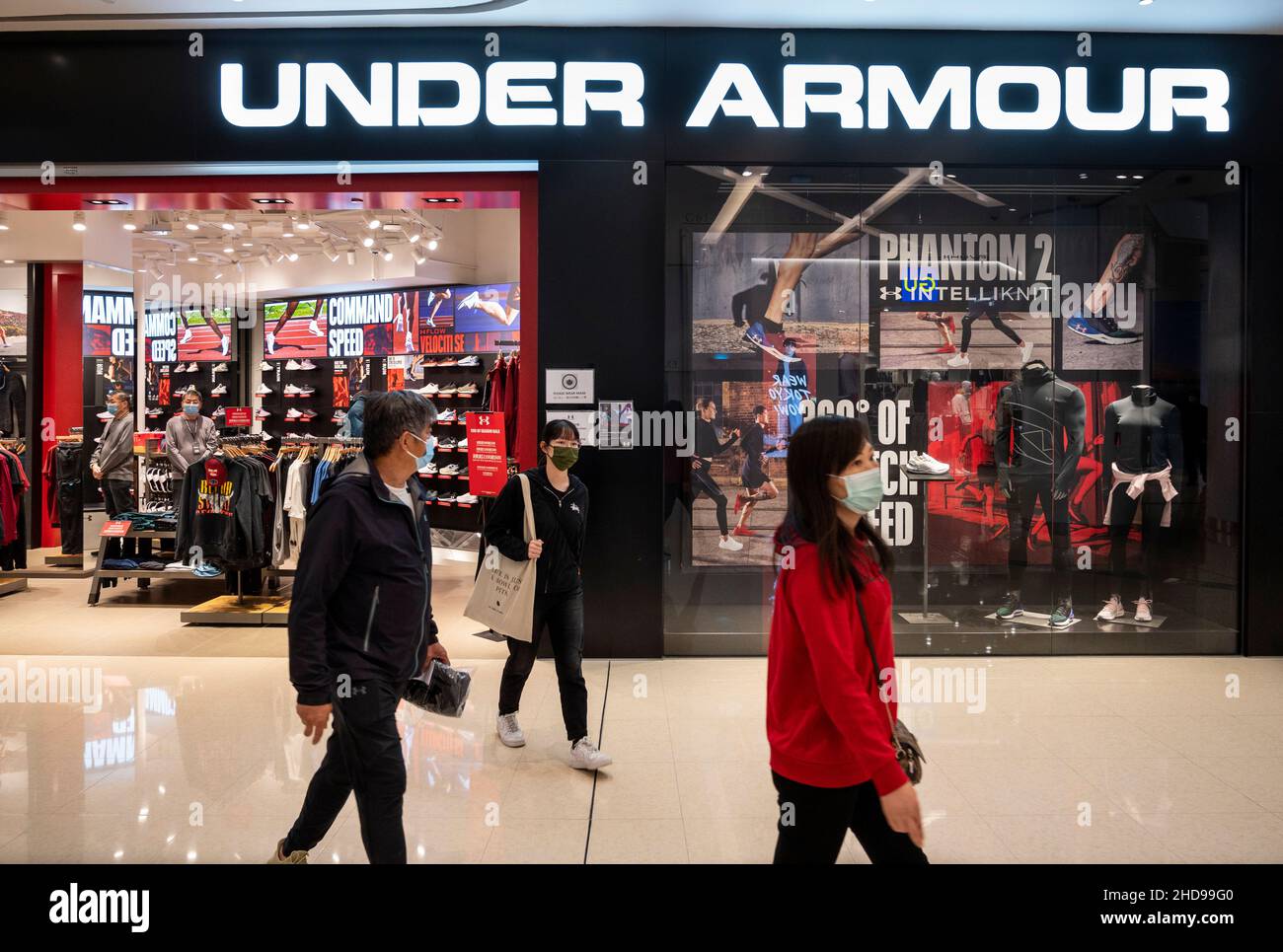Hong Kong, China. 23rd Dec, 2021. Shoppers walk past the American ...