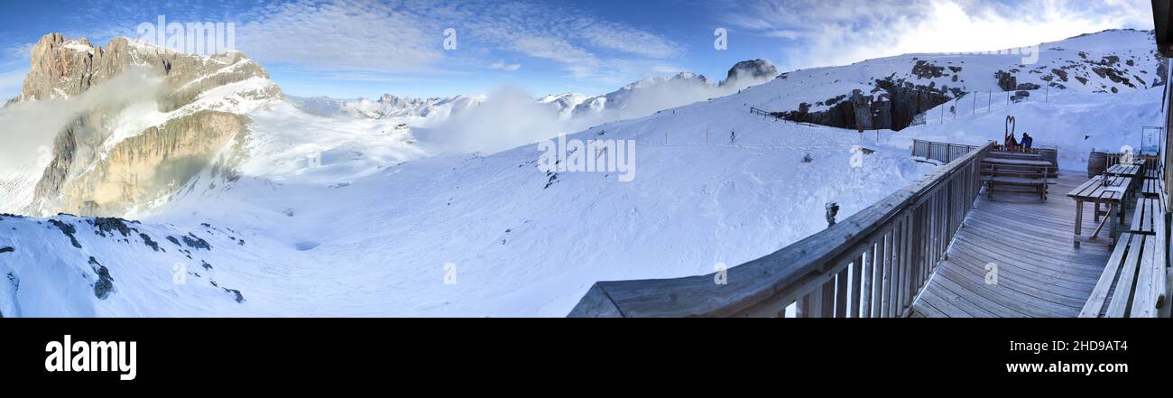 Cimon della Pala and Cima Vezzana on Dolomites in Trentino Alto Adige with blue sky background during winter season and snomy lanscape Stock Photo