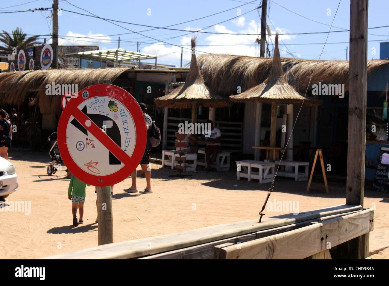 A street sign indicating not to turn left in Punta del Diablo, Rocha, Uruguay. Stock Photo