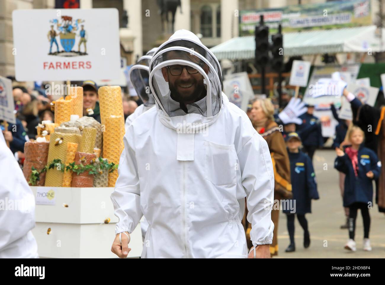 Bee keepers with the Worshipful Company of Farmers, taking part in the Lord Mayor's Show 2021 parade, in the heart of the City of London, UK Stock Photo