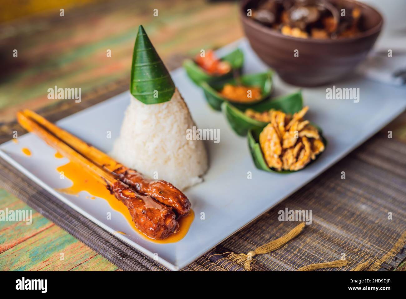 Lifestyle food. A dish consisting of rice, fried fish with wood