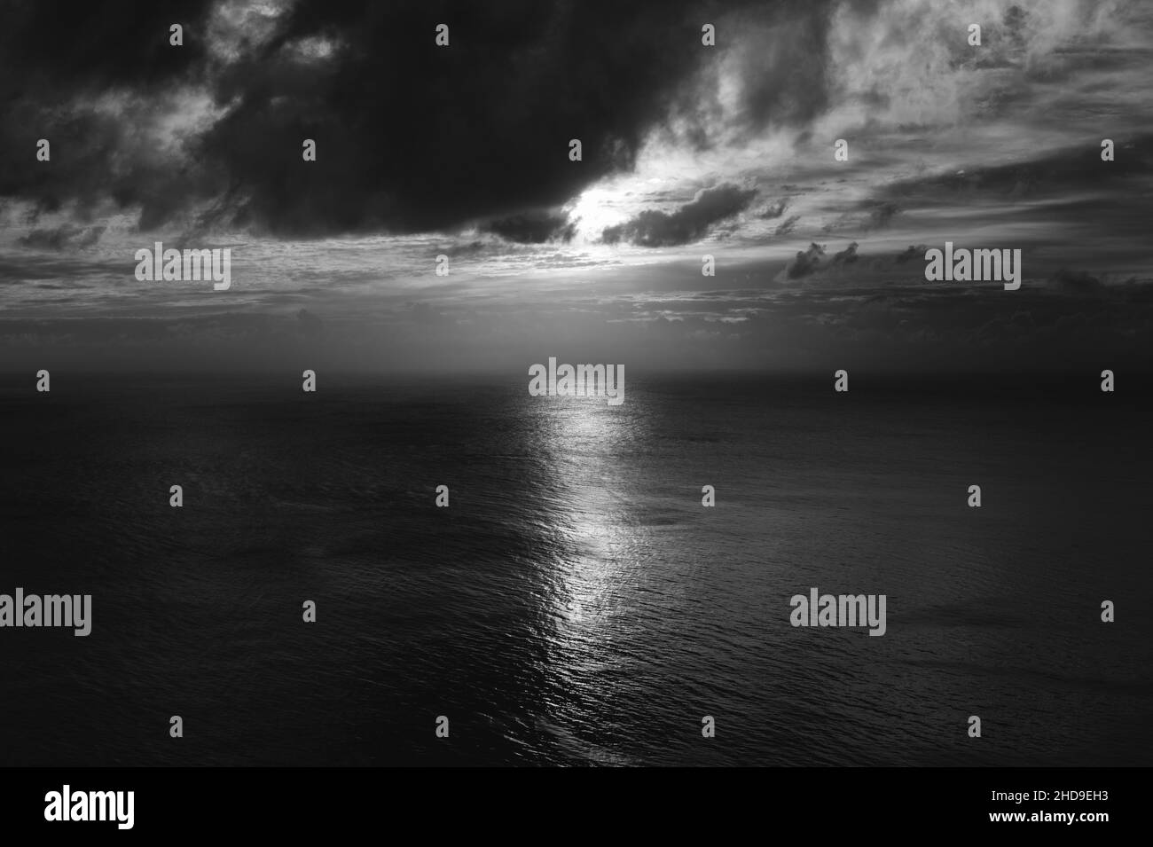 Mesmerizing black and white aerial view of the Baltic Sea with the sun ...