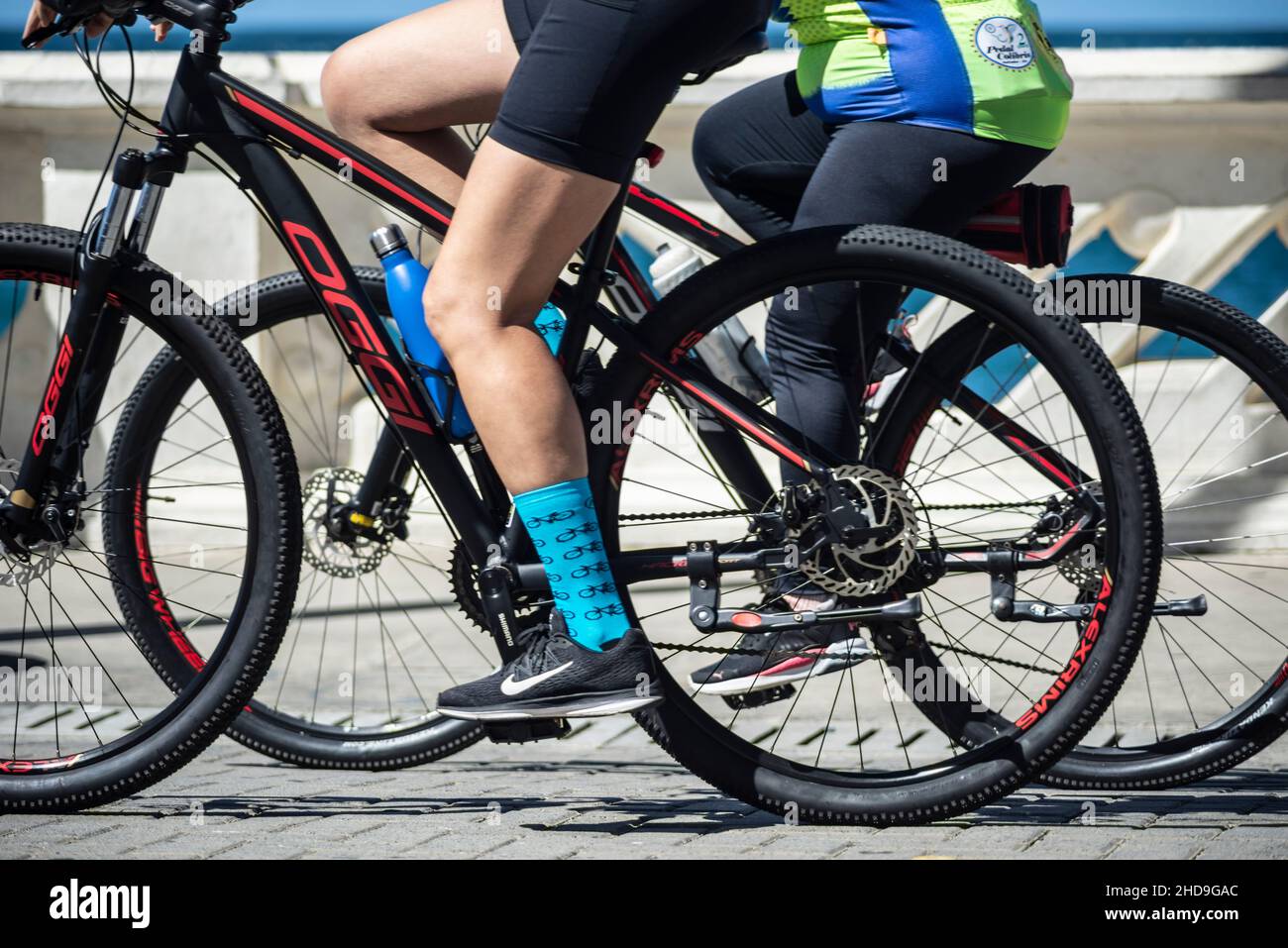 Salvador, Bahia, Brazil - August 15, 2021: Many cyclists strolling through the streets of Farol da Barra in the Brazilian city of Salvador. Stock Photo