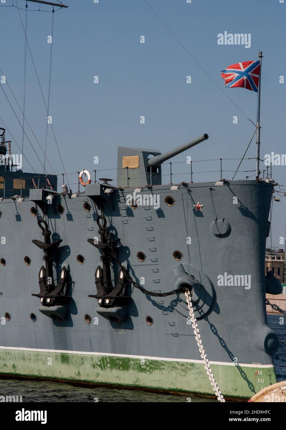 Cruiser Aurora moored at St Petersburg, Russia.  The jack flag flying at the bow.  The bow gun reportedly fired the shot signalling the Revolution. Stock Photo
