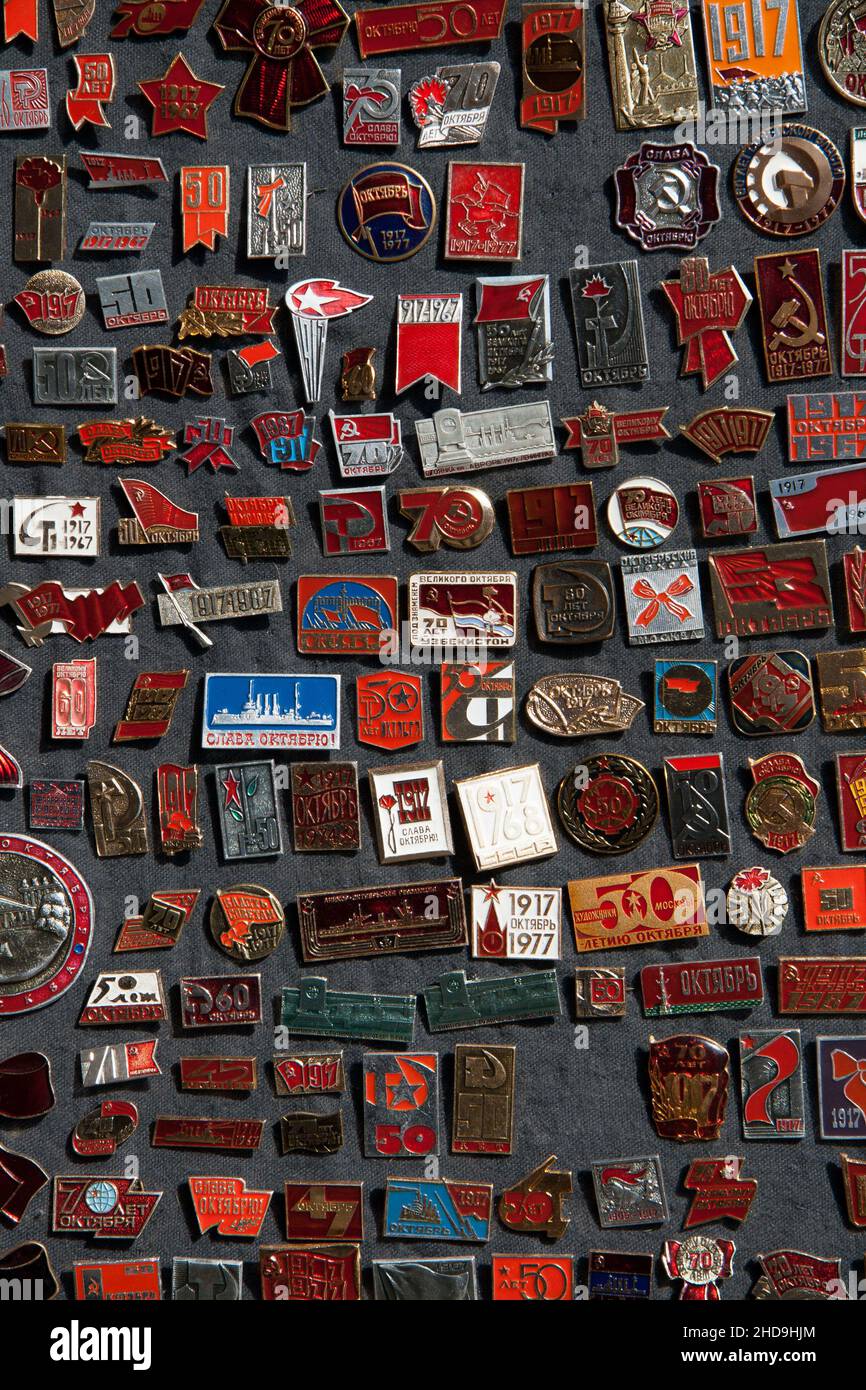 A selection of badges and fridge magnets depicting various Russian organisations and patriotic events.  St Petersburg, Russia. Stock Photo