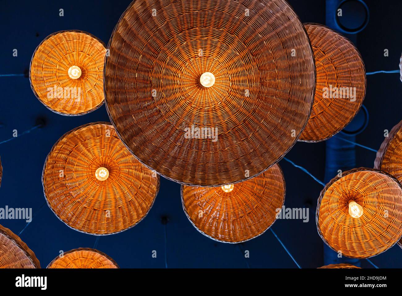 lamps in straw shades on the ceiling for decoration Stock Photo Alamy