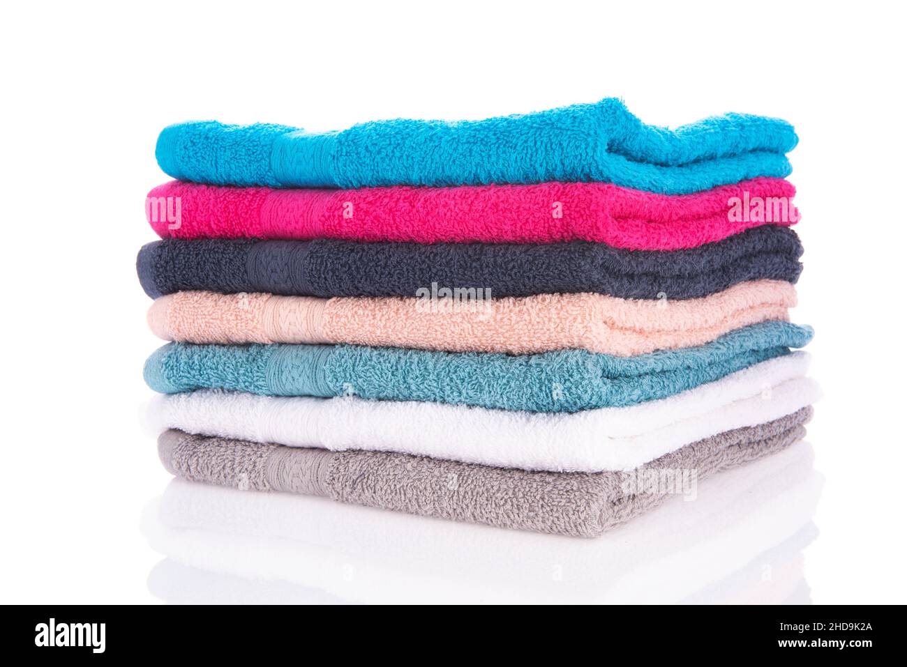 Stacked towels isolated over white background Stock Photo