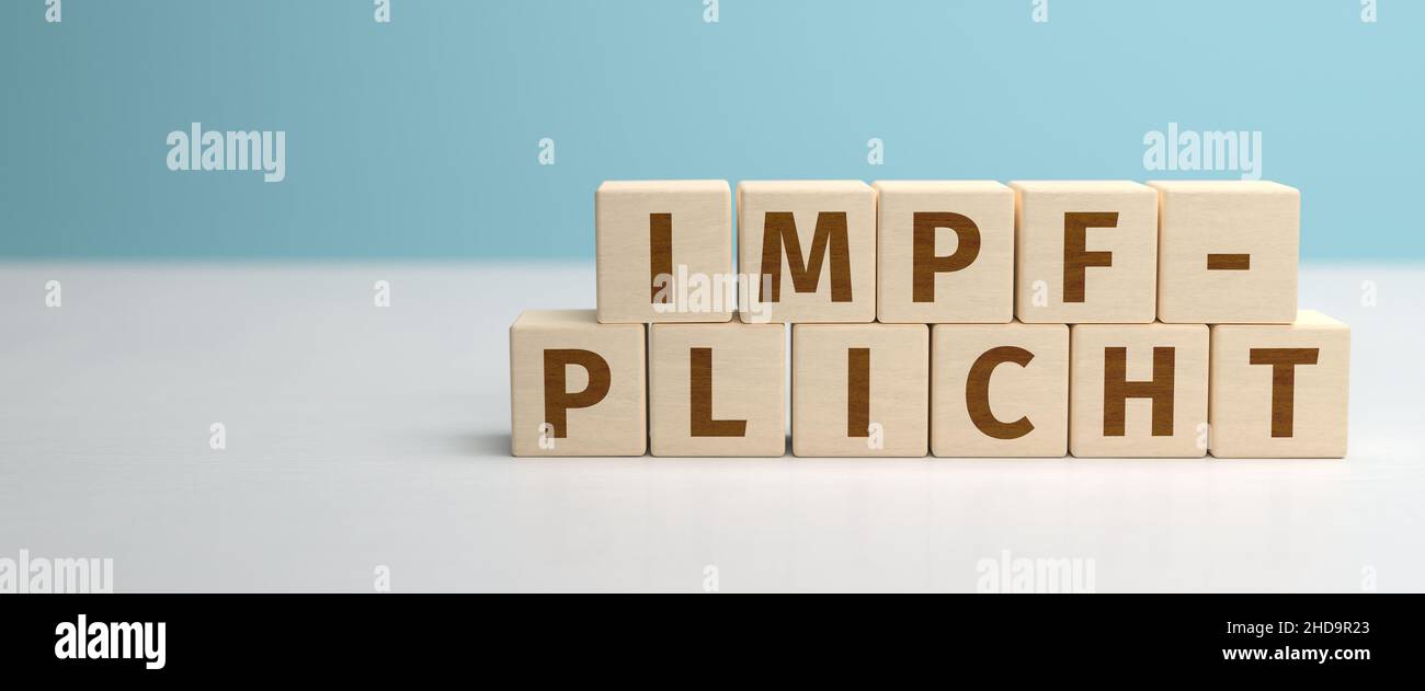 The German word Impfpflicht (mandatory vaccination) built from letters on wooden cubes. Web banner format Stock Photo