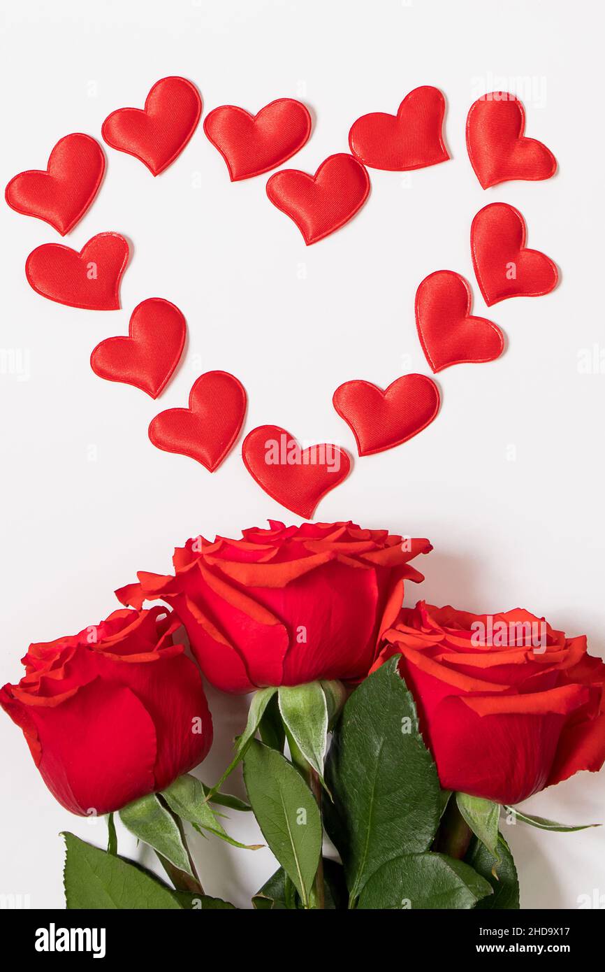 Frame from red hearts and roses on white background. Valentine's day ...