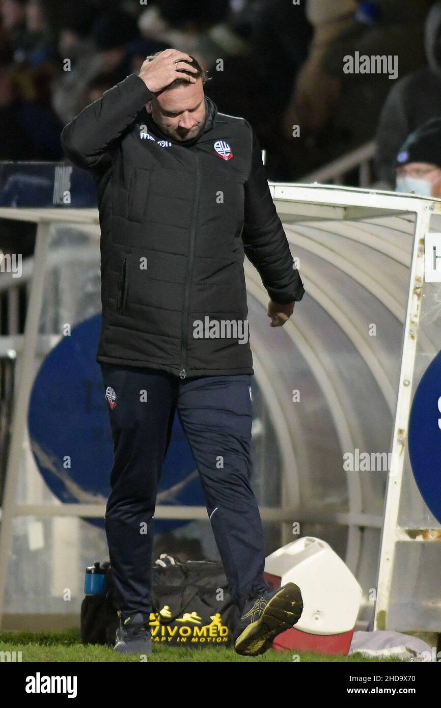 HARTLEPOOL, UK. JAN 4TH Bolton Wanderers manager can only hold his head in his hand as Hartlepool United Claim another league One cup scalp at the full time whistle in EFL Trophy 3rd round match between Hartlepool United and Bolton Wanderers at Suits Direct Stadium, Hartlepool on Tuesday 4th January 2022. (Credit: Scott Llewellyn | MI News)L Credit: MI News & Sport /Alamy Live News Stock Photo