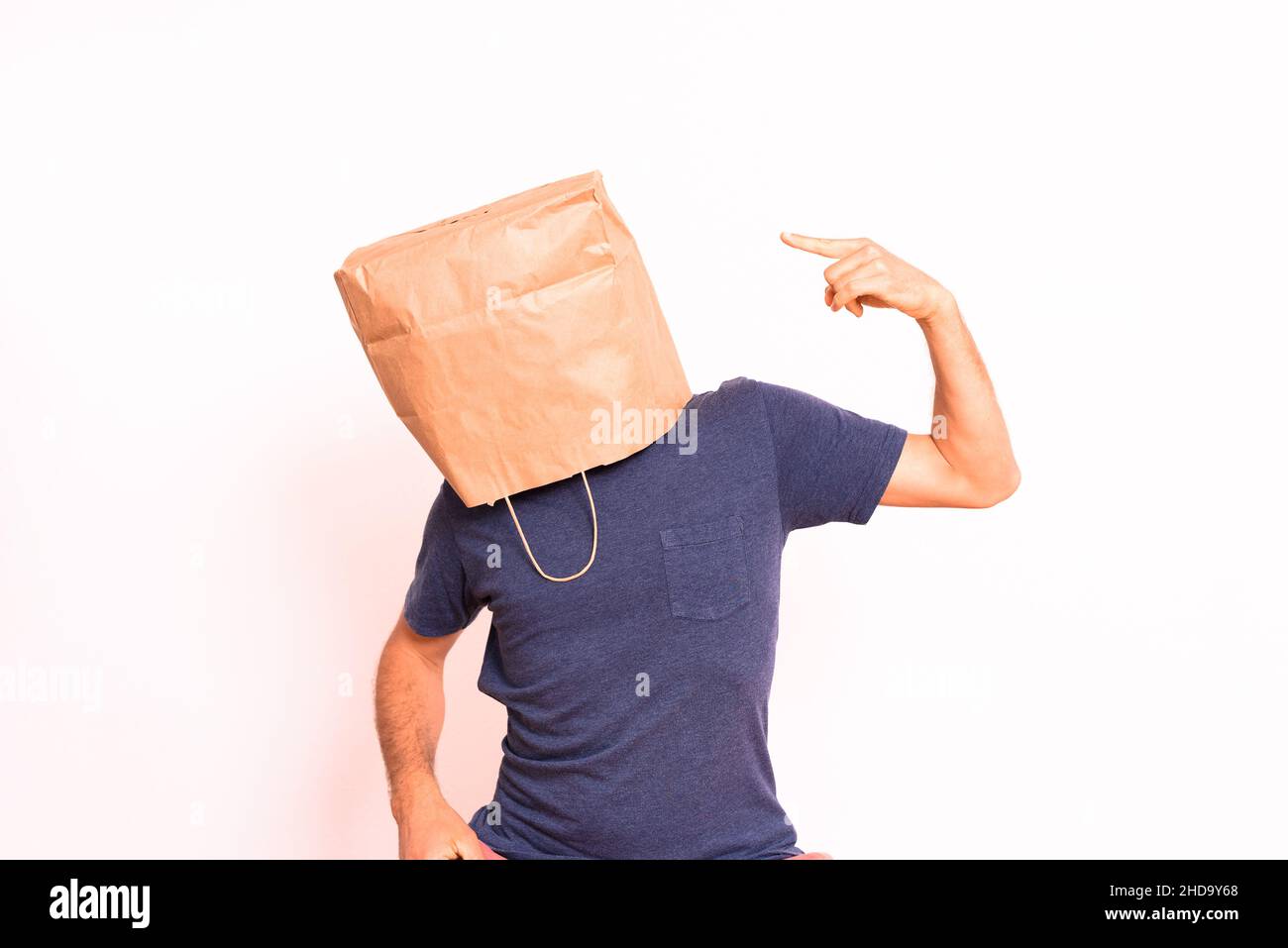Premium Photo  Kraft paper bag is on the man's head. holes for eyes. funny  idea. guy is angry.
