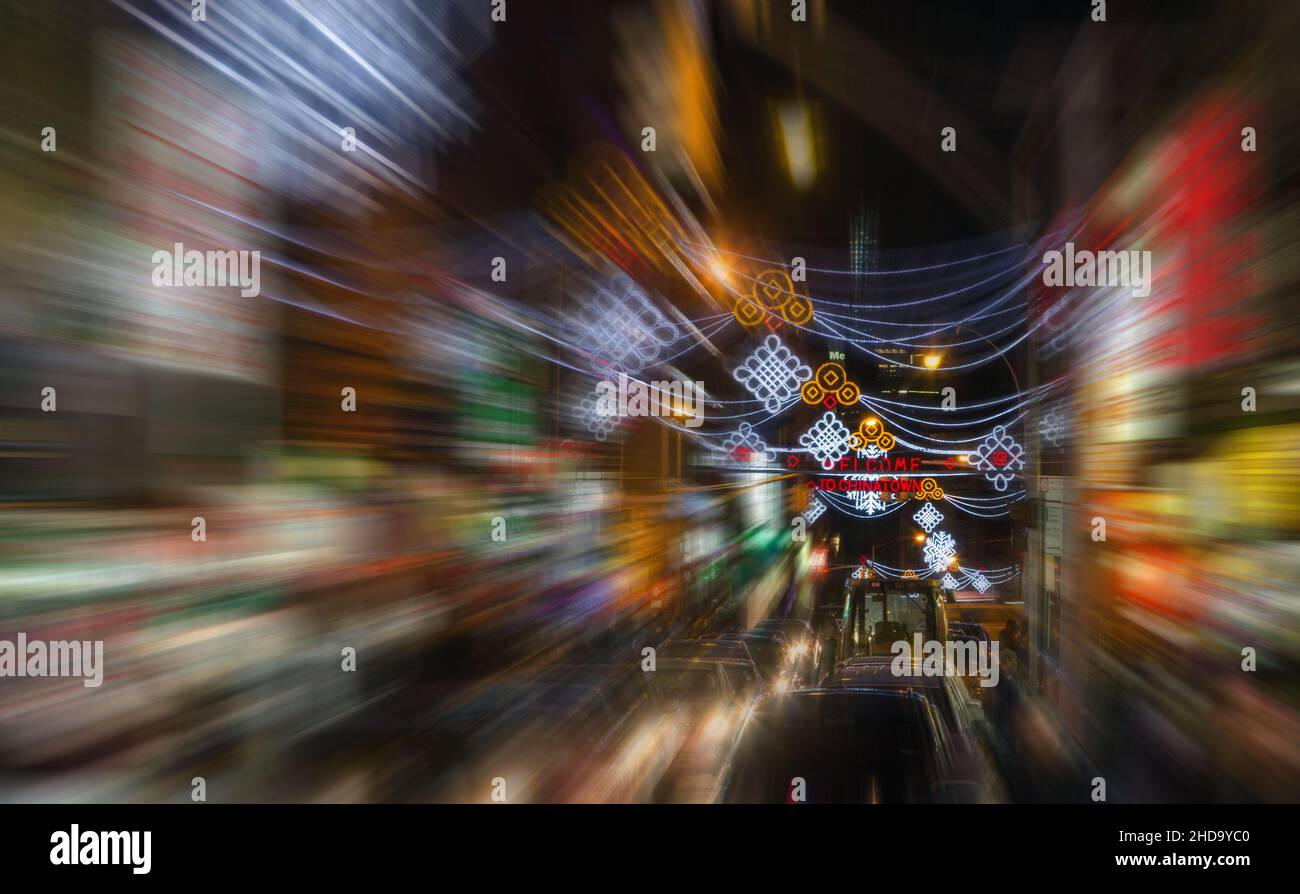 Motion blurred abstract lights of a busy nighttime street scene in ...