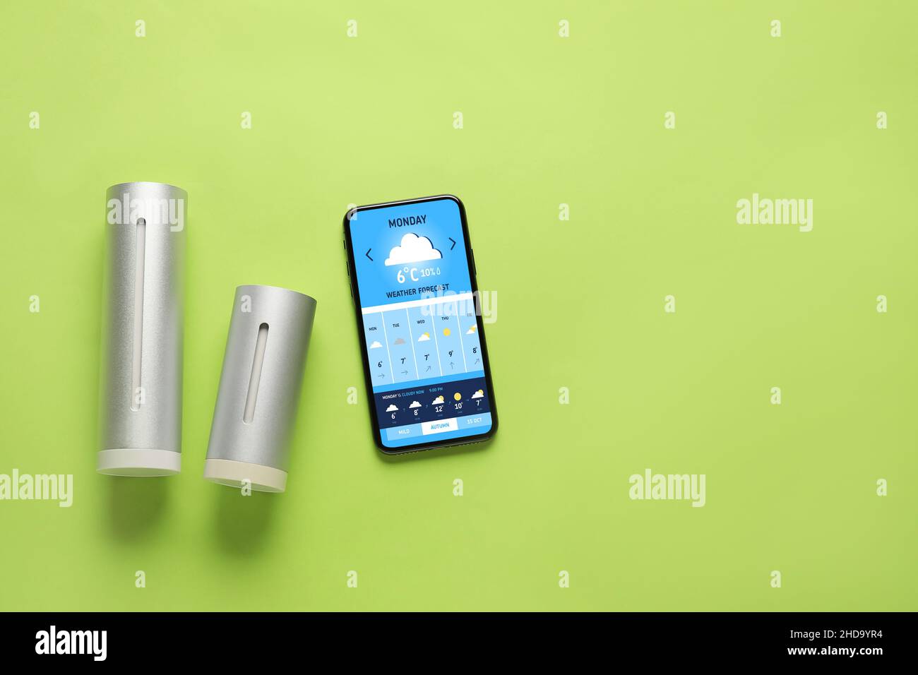 Weather forecast equipment and mobile phone on color background with