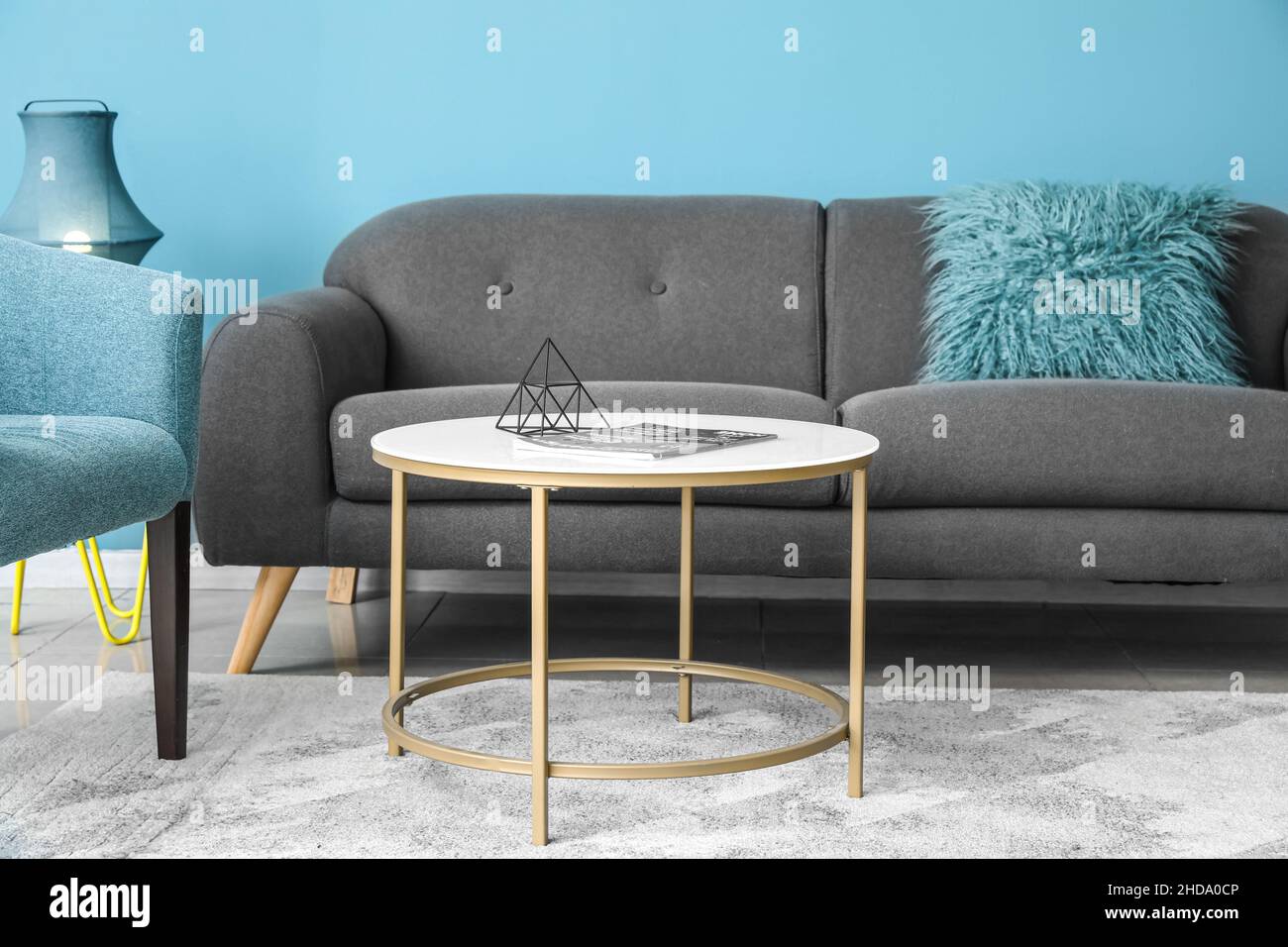 Interior of stylish living room with sofa and coffee table Stock Photo ...