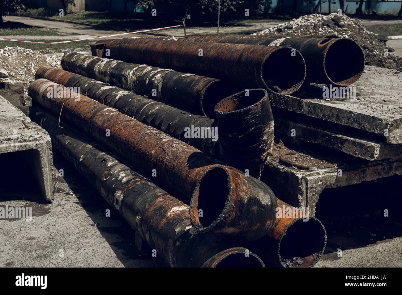 road repair. detour sign. a dug road in the city near the residential ladies. large, iron pipes. Stock Photo