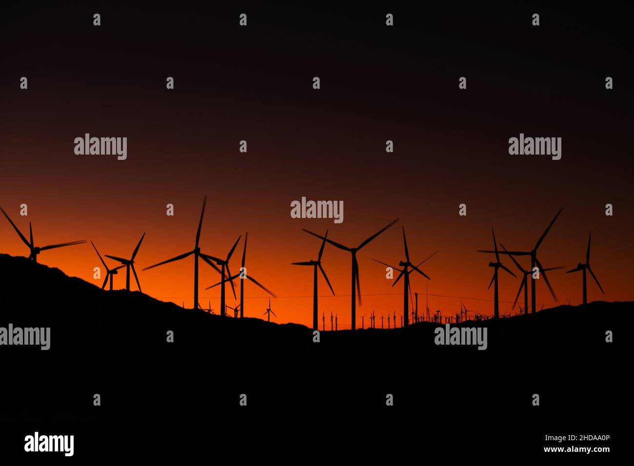Wind Power Generation Using Wind Energy in Coachella Valley, California. Scenic Sunset. Green Power Industry Theme. Stock Photo