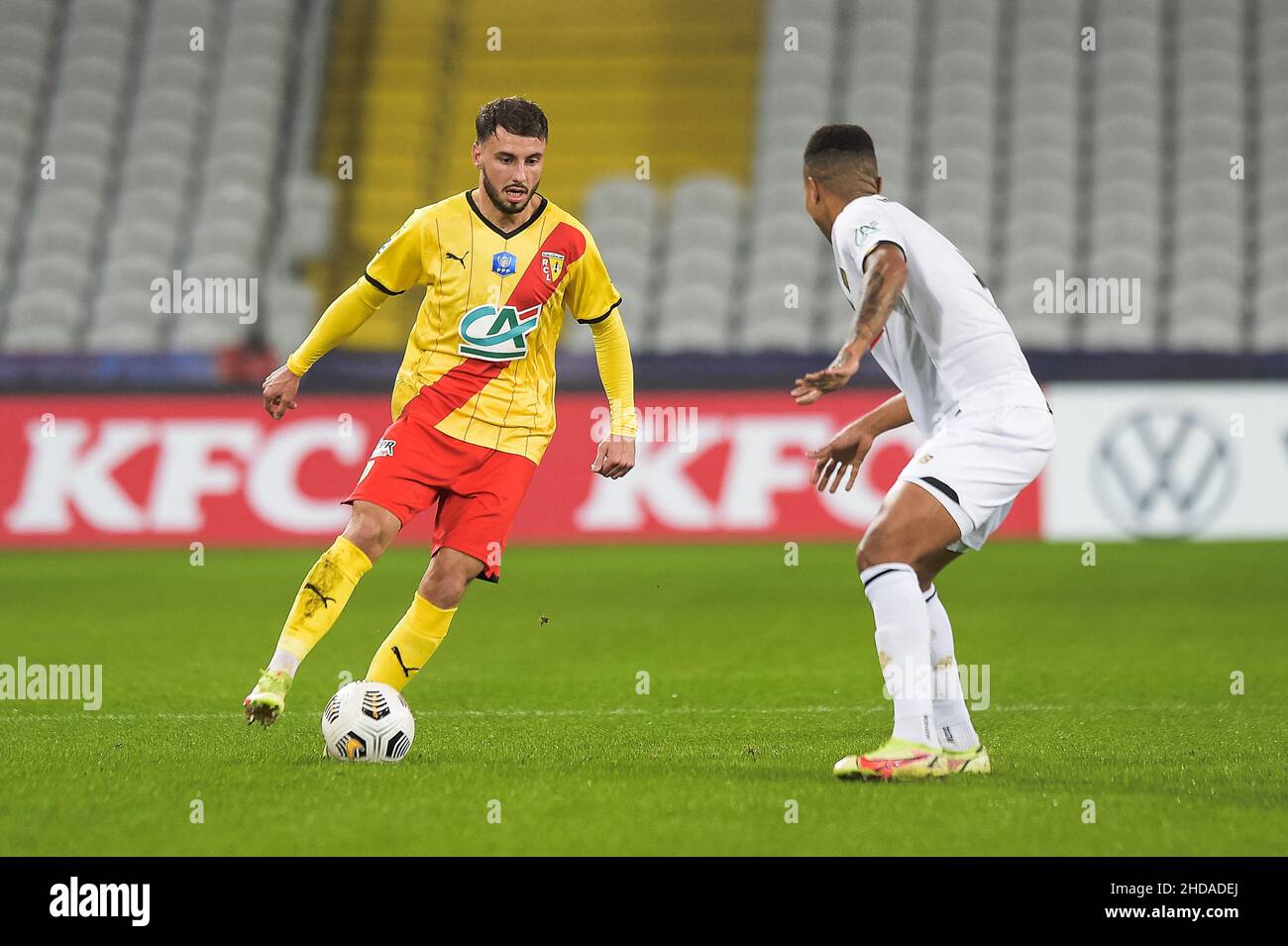 Lens' Jonathan Clauss fights for the ball with during the French Cup football  match Lens (RCL) against Lille (LOSC) at Stade Bollaert Delelis in Lens on  January 4, 2022.. Photo by Julie