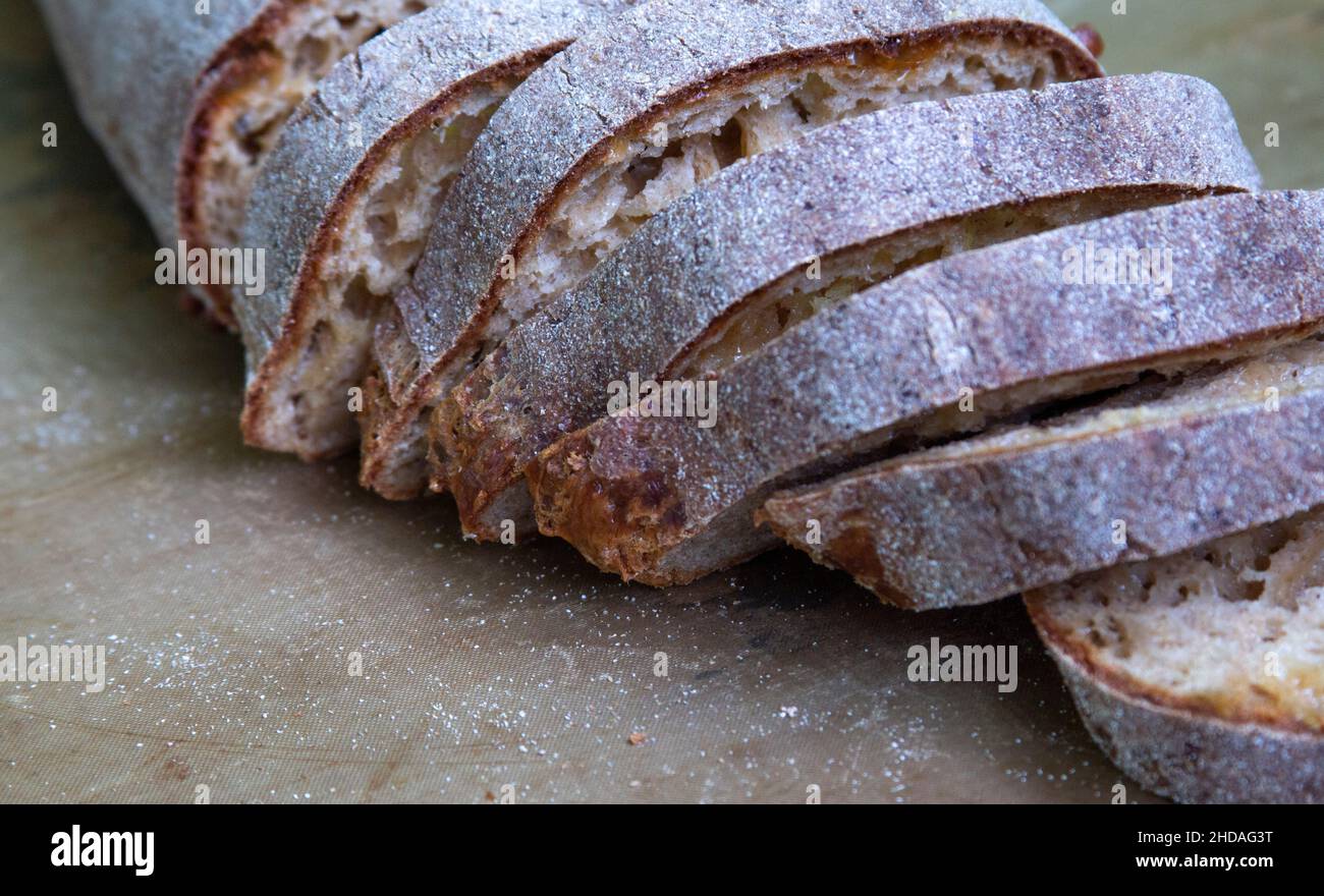Whole grain sliced bread lying on the table Stock Photo - Alamy