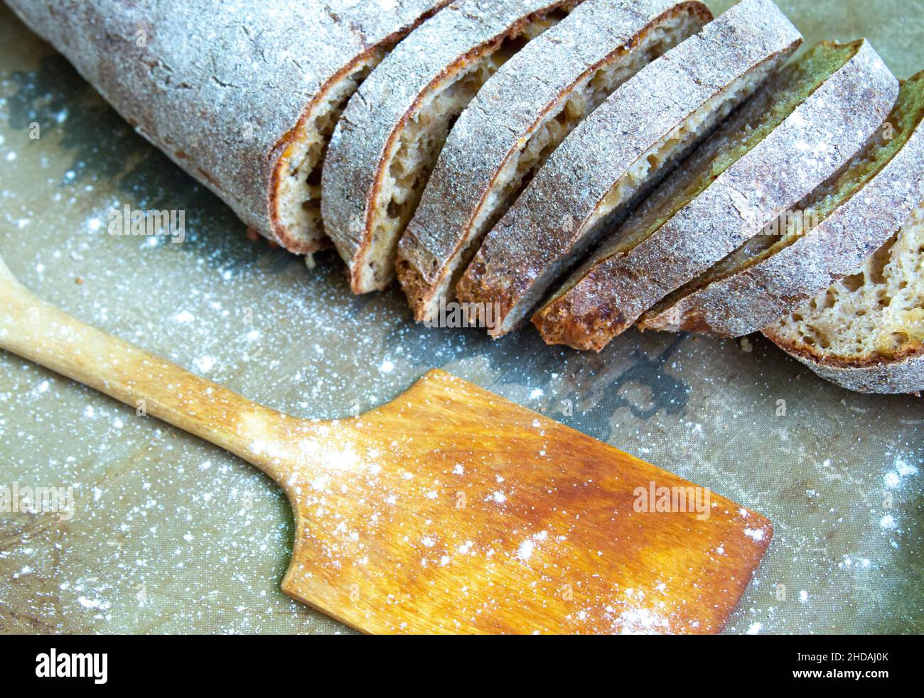 Fresh whole grain bread sprinkled with flour, top view, healthy food ...