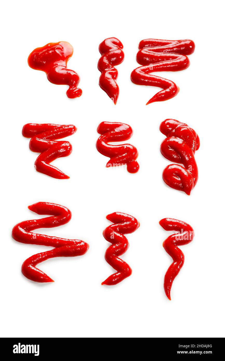 Ketchup splashes isolated on white background. Stock Photo