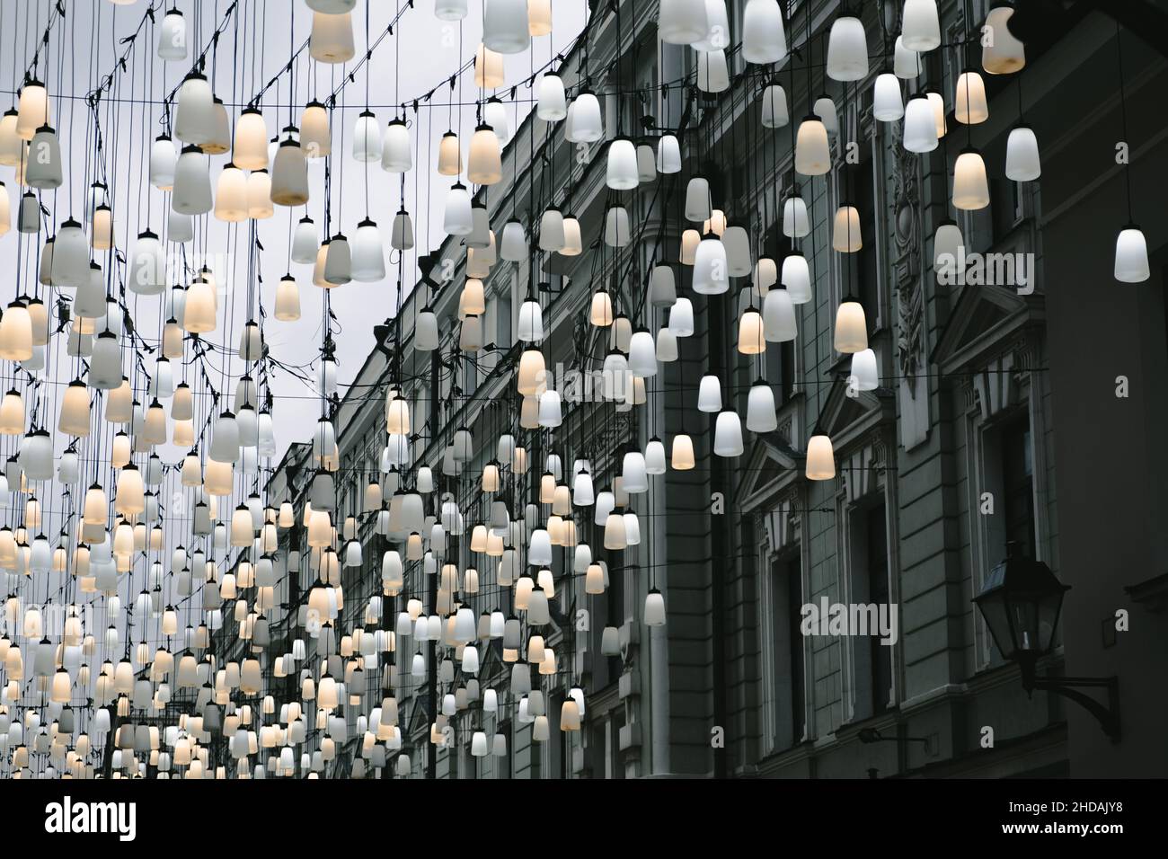 A beautiful street decorated with lanterns. Decoration of the city for the new year. Stoleshnikov Lane, Moscow. High quality photo Stock Photo