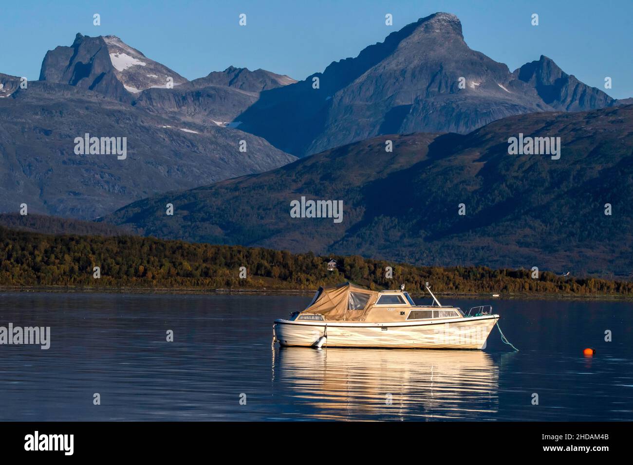 Motorboot im Morgenlicht / motor boat in morning light Stock Photo