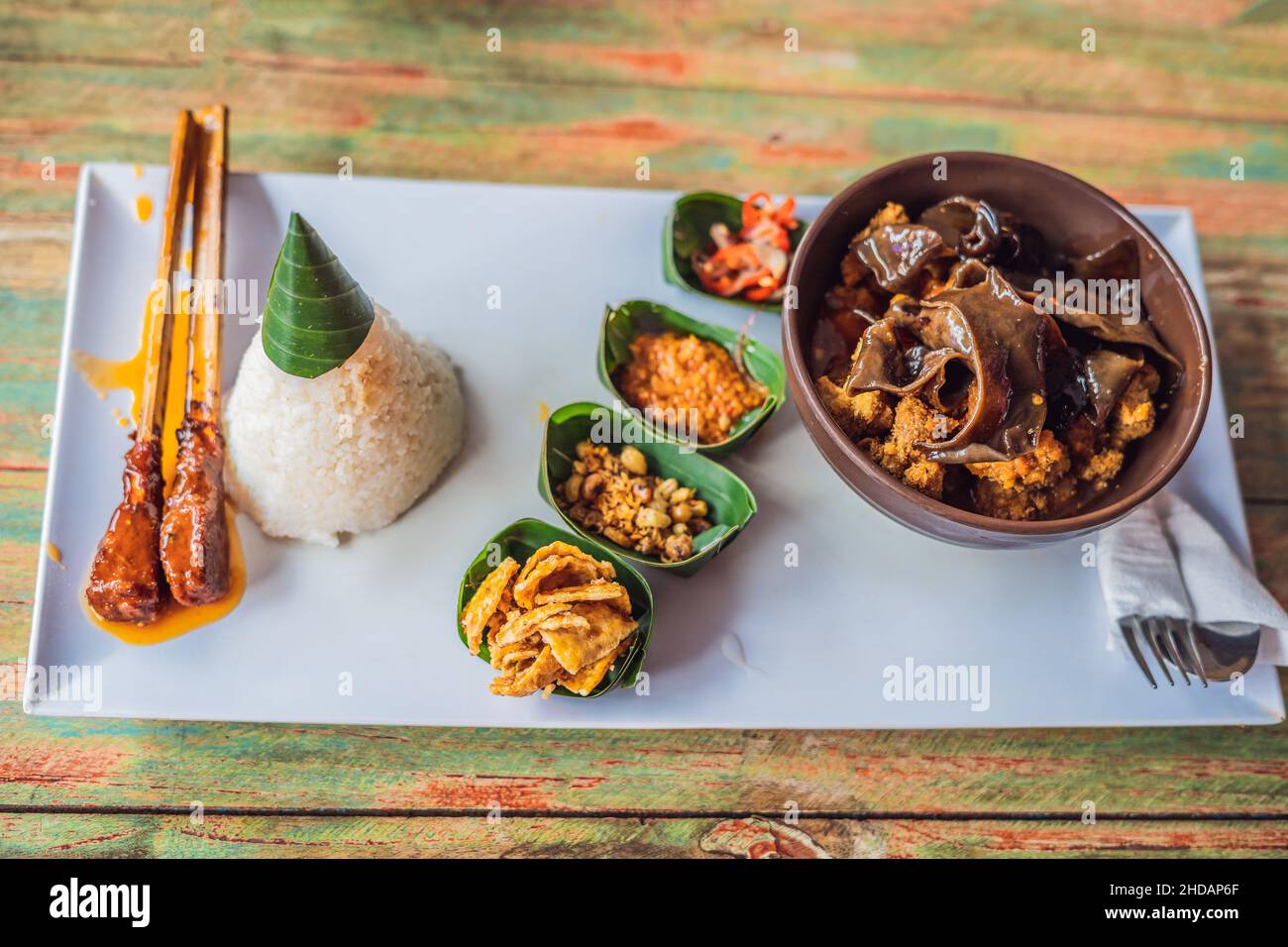 Lifestyle food. A dish consisting of rice, fried fish with wood