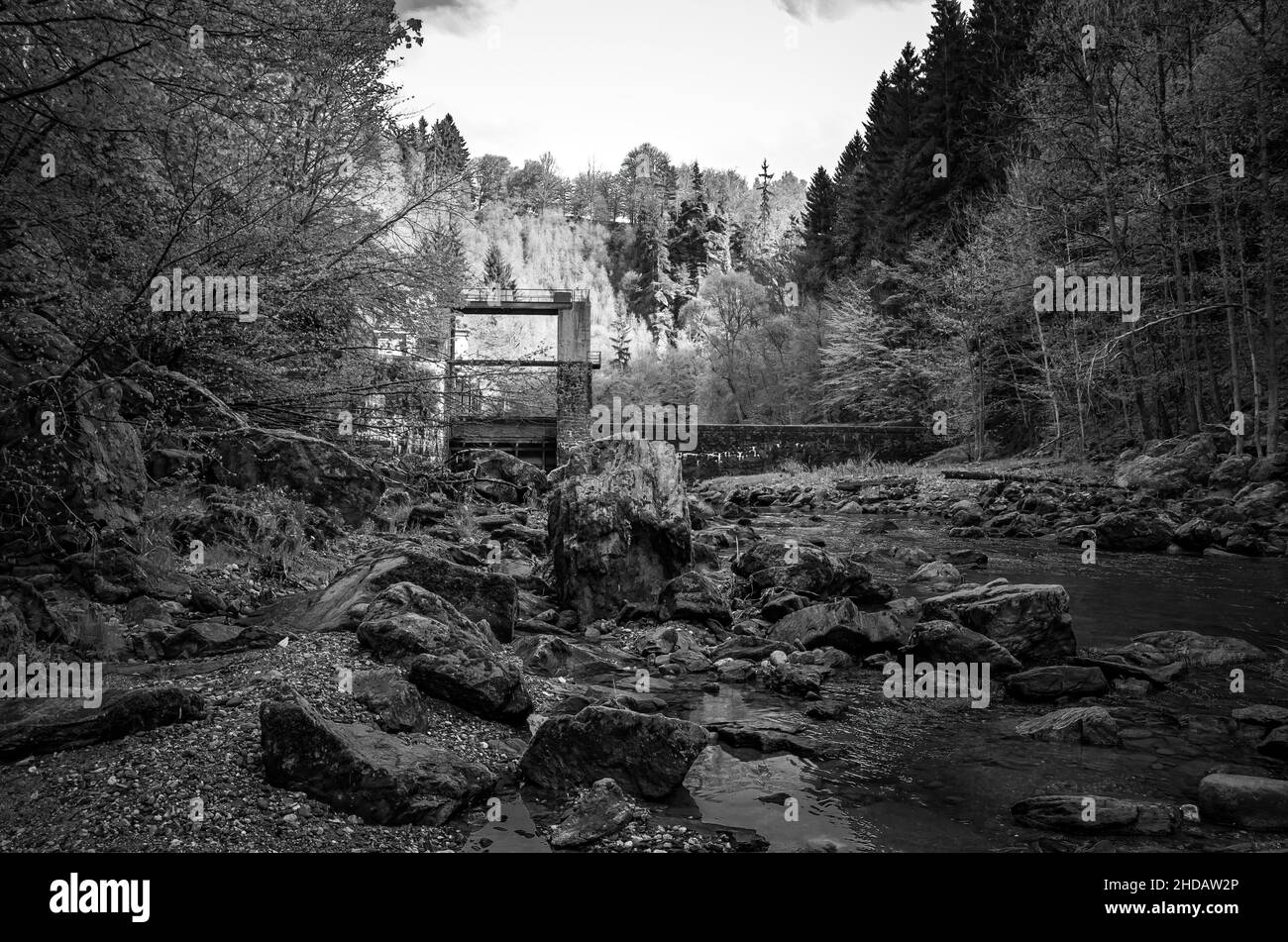 In the riverbed of the Jizera near Bitouchov, Bohemian Paradise (Cesky Raj), Stredocesky kraj, Czech Republic: View of rock scree and the dam. Stock Photo