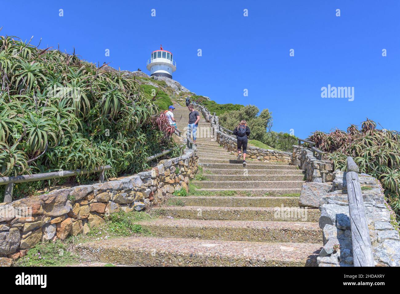 CAPE POINT, SOUTH AFRICA - DEC 23, 2021: Steps leading to the old lighthouse at Cape Point in the Table Mountain National Park. People are visible Stock Photo