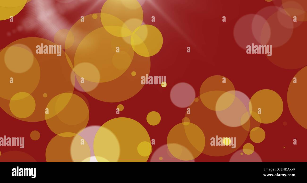 Image of glowing yellow spots on red background Stock Photo - Alamy
