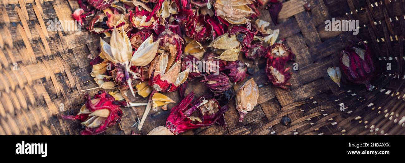 Heap of dried roselle flower. Red fruit tea carcade. Hibiscus sabdariffa. Top view BANNER, long format Stock Photo