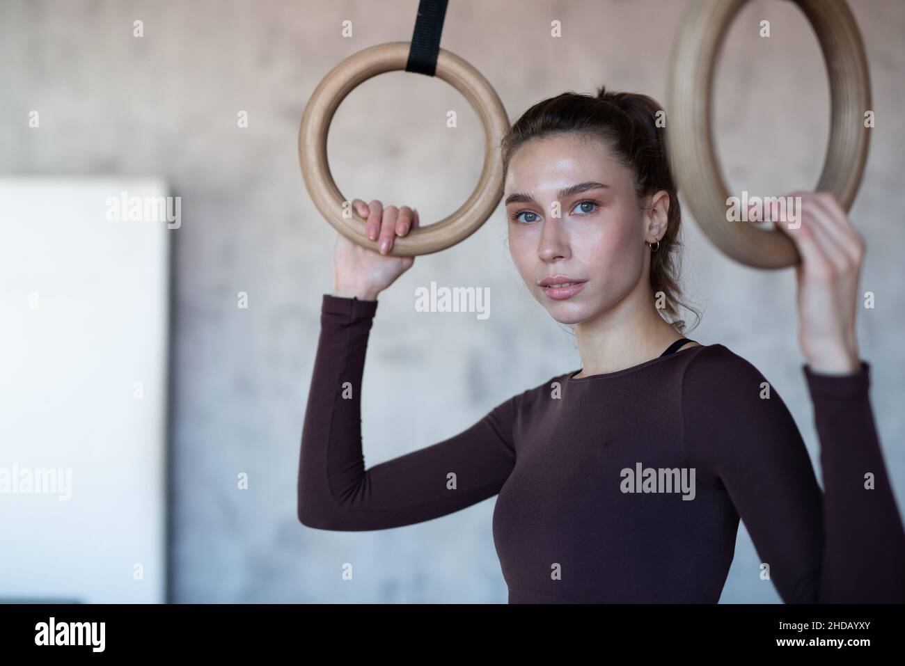 Fit woman with gymnastic rings at the gym Stock Photo Alamy