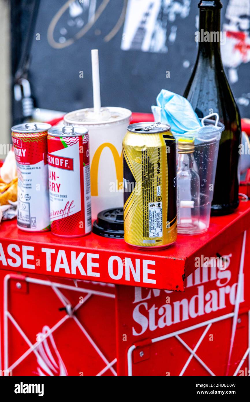 London England UK January 02 2022, Pile Of Used Empty Cans Bottles And Food Left On Newspaper Stand Waterloo Station London Stock Photo