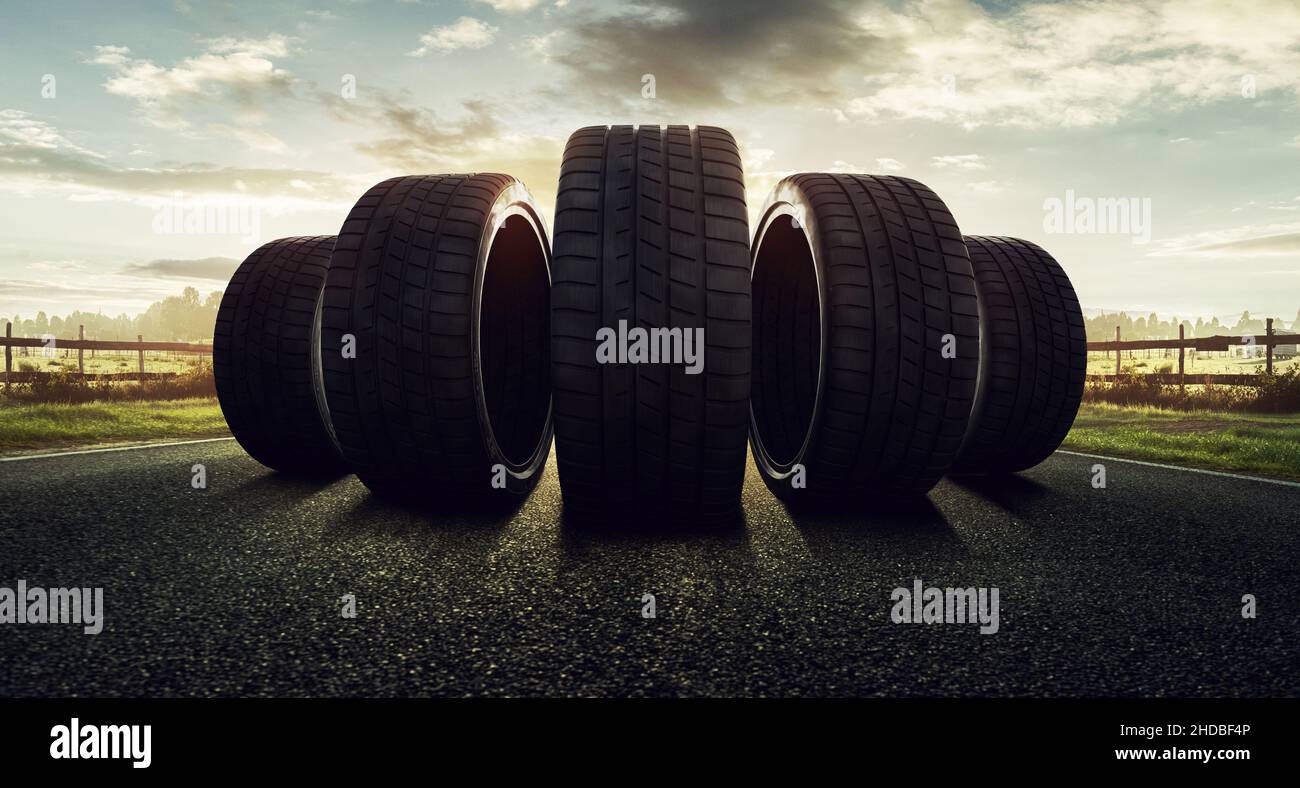 winter summer car tyres on a road Stock Photo Alamy