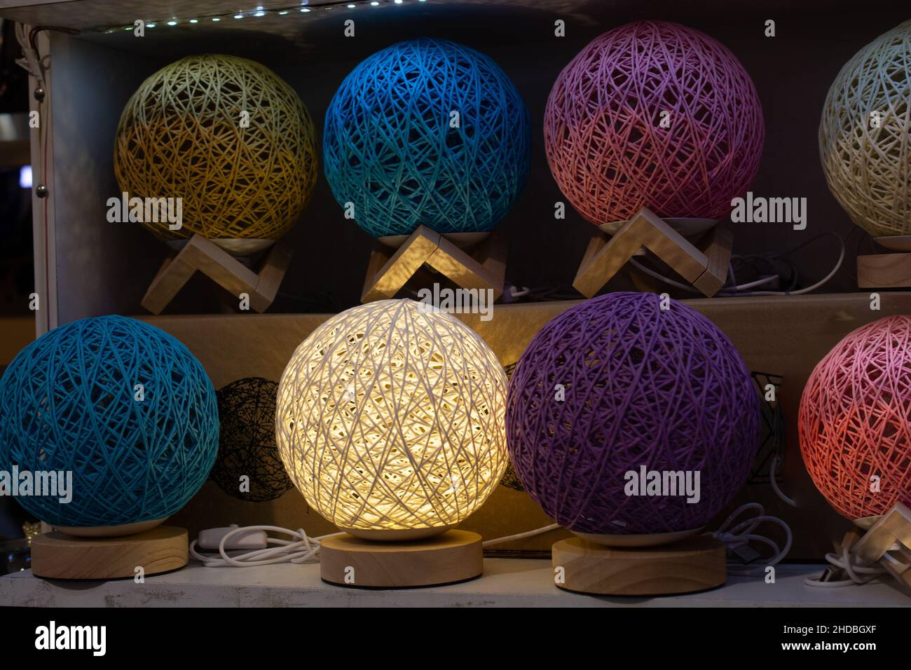 Line of colorful ball lamp made of cotton threads Stock Photo - Alamy