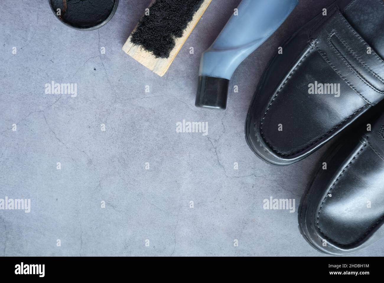 cleaning Shoe brush and shoe on black background  Stock Photo