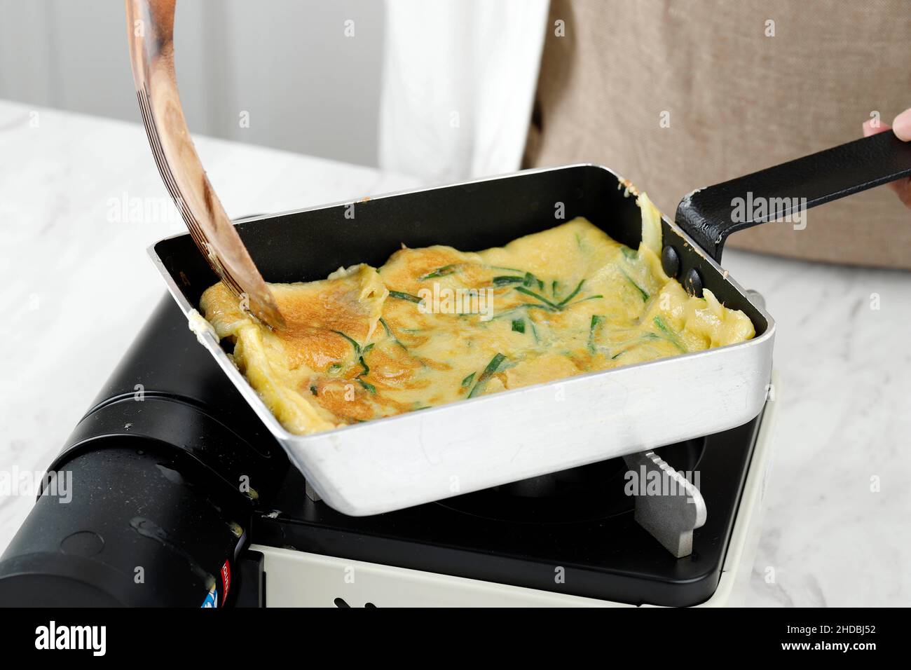 Process Making Korean Pancake Jeon Pajeon on the Stove Stock Photo