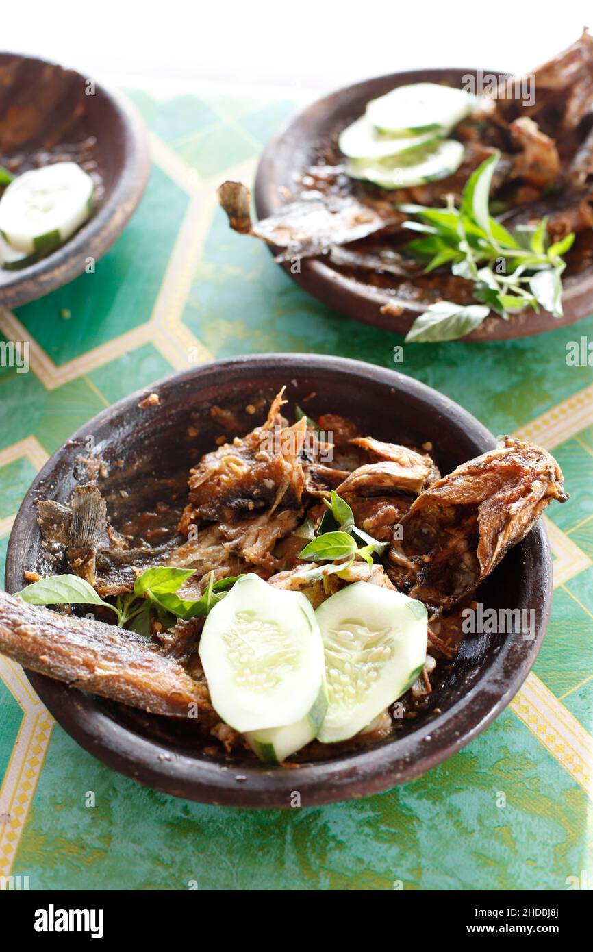 Lele Penyet Cobek, Fried Catfish with Spicy Sambal. Popular as Penyetan Lele Stock Photo