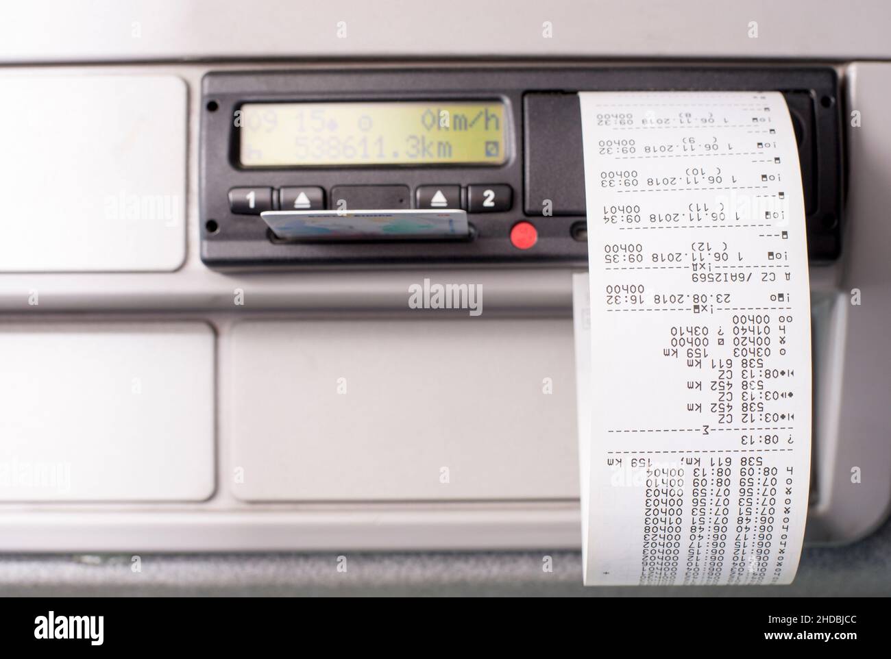 Digital tachograph with printed time records and driver card half inserted Stock Photo Alamy