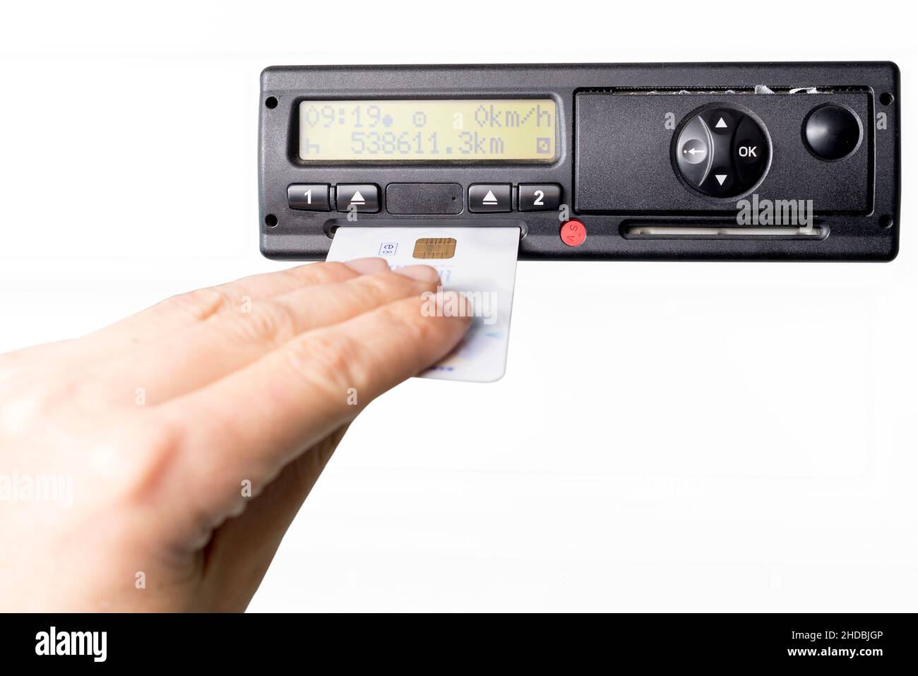 Digital tachograph and drivers hand inserting drivers card in it. No
