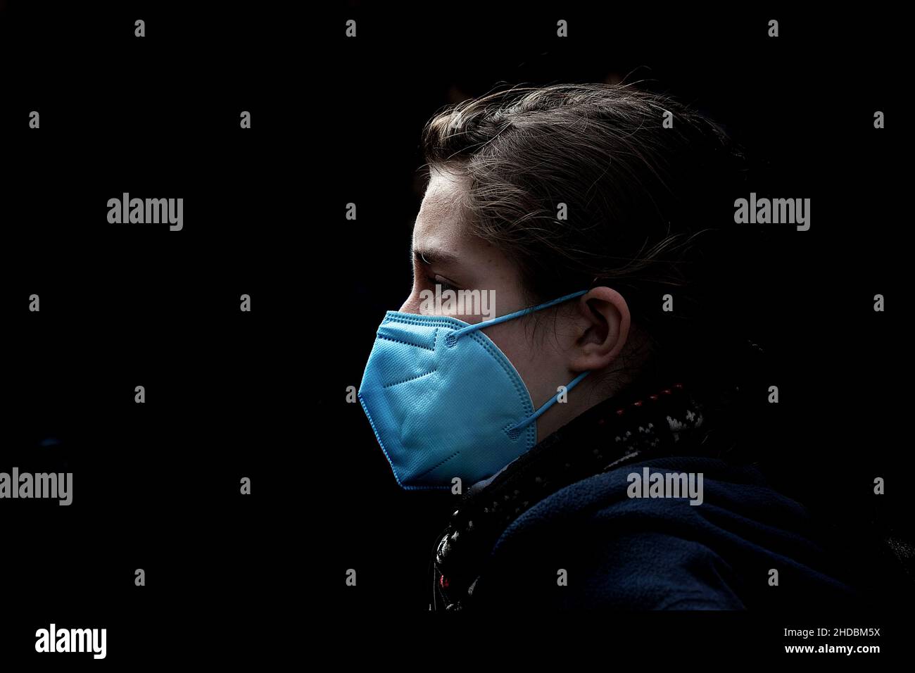Teenage boy wearing face mask in the street, Barcelona, Spain Stock