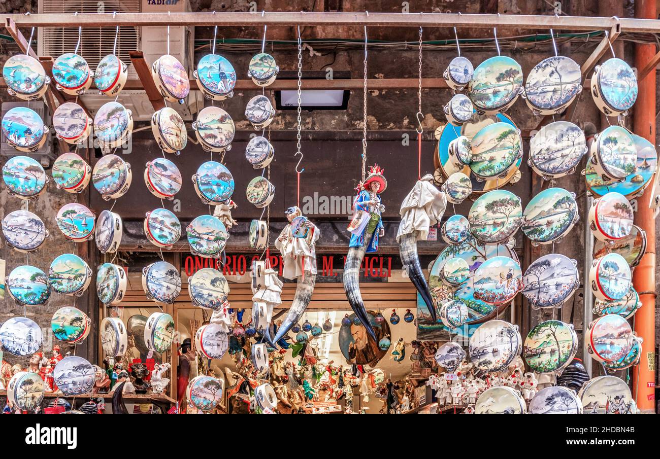 Naples, Italy - june 29 2021: tambourines hanging and displayed in a shop on the famous Via San Gregorio Armeno Stock Photo