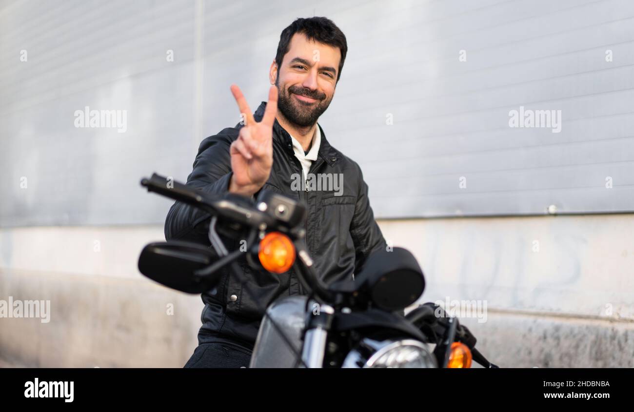 Young motorcycle rider biker celebrating hi-res stock photography and ...